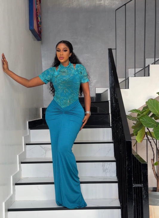 Teal green mesh top paired with teal green long strechy skirt.