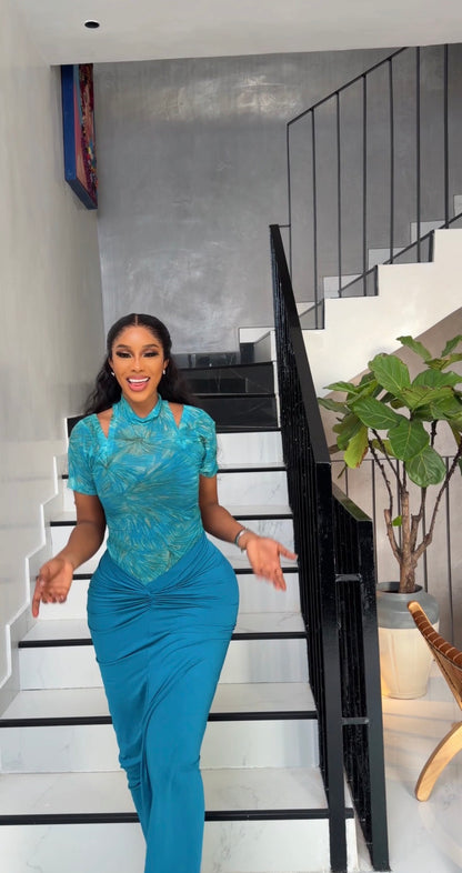 Teal green mesh top paired with teal green long strechy skirt.